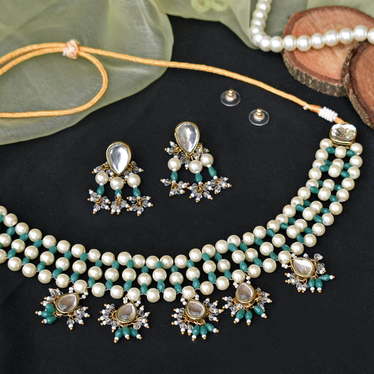 Kundan choker set in gold-tone with matching earrings and long bridal necklace, perfect for wedding functions , festive and bridal wear