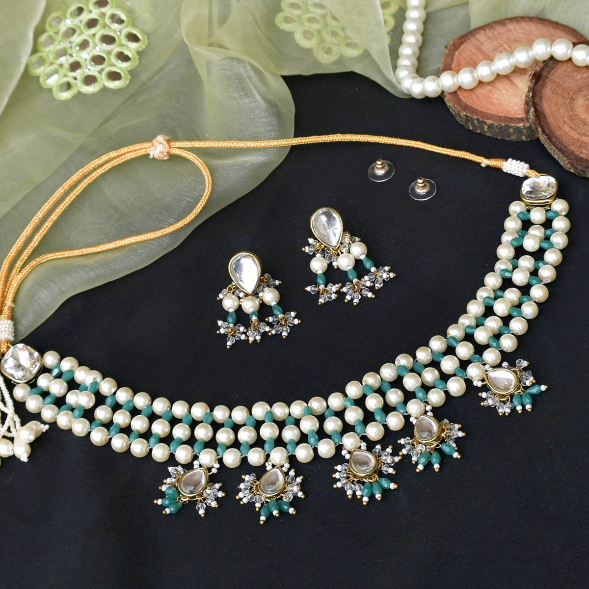 Kundan choker set in gold-tone with matching earrings and long bridal necklace, perfect for wedding functions , festive and bridal wear