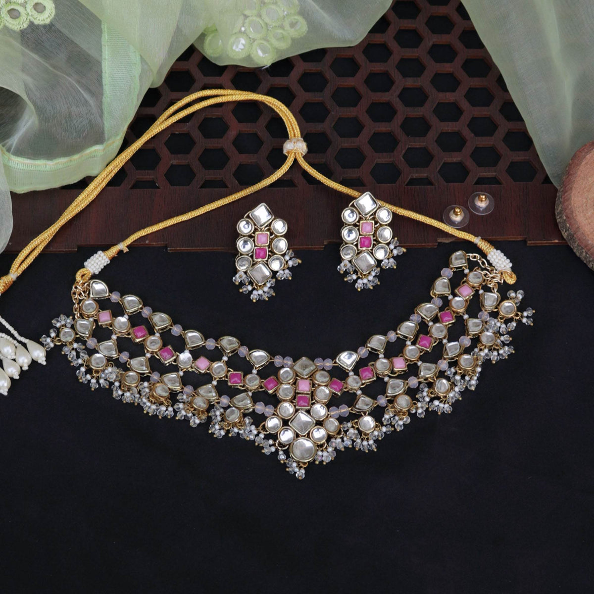 Kundan choker set in gold-tone with matching earrings and long bridal necklace, perfect for wedding functions , festive and bridal wear