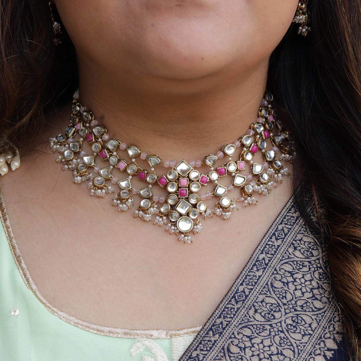 Kundan choker set in gold-tone with matching earrings and long bridal necklace, perfect for wedding functions , festive and bridal wear