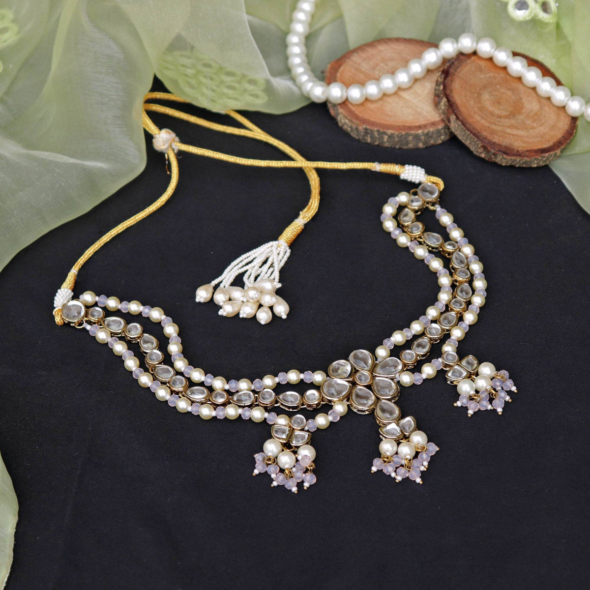 Kundan choker set in gold-tone with matching earrings and long bridal necklace, perfect for wedding functions , festive and bridal wear