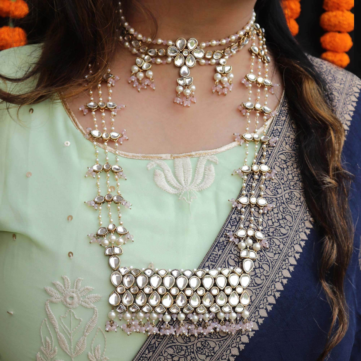 Kundan choker set in gold-tone with matching earrings and long bridal necklace, perfect for wedding functions , festive and bridal wear