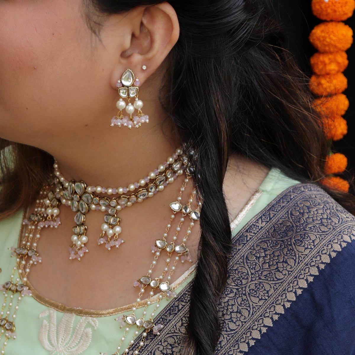 Kundan choker set in gold-tone with matching earrings and long bridal necklace, perfect for wedding functions , festive and bridal wear