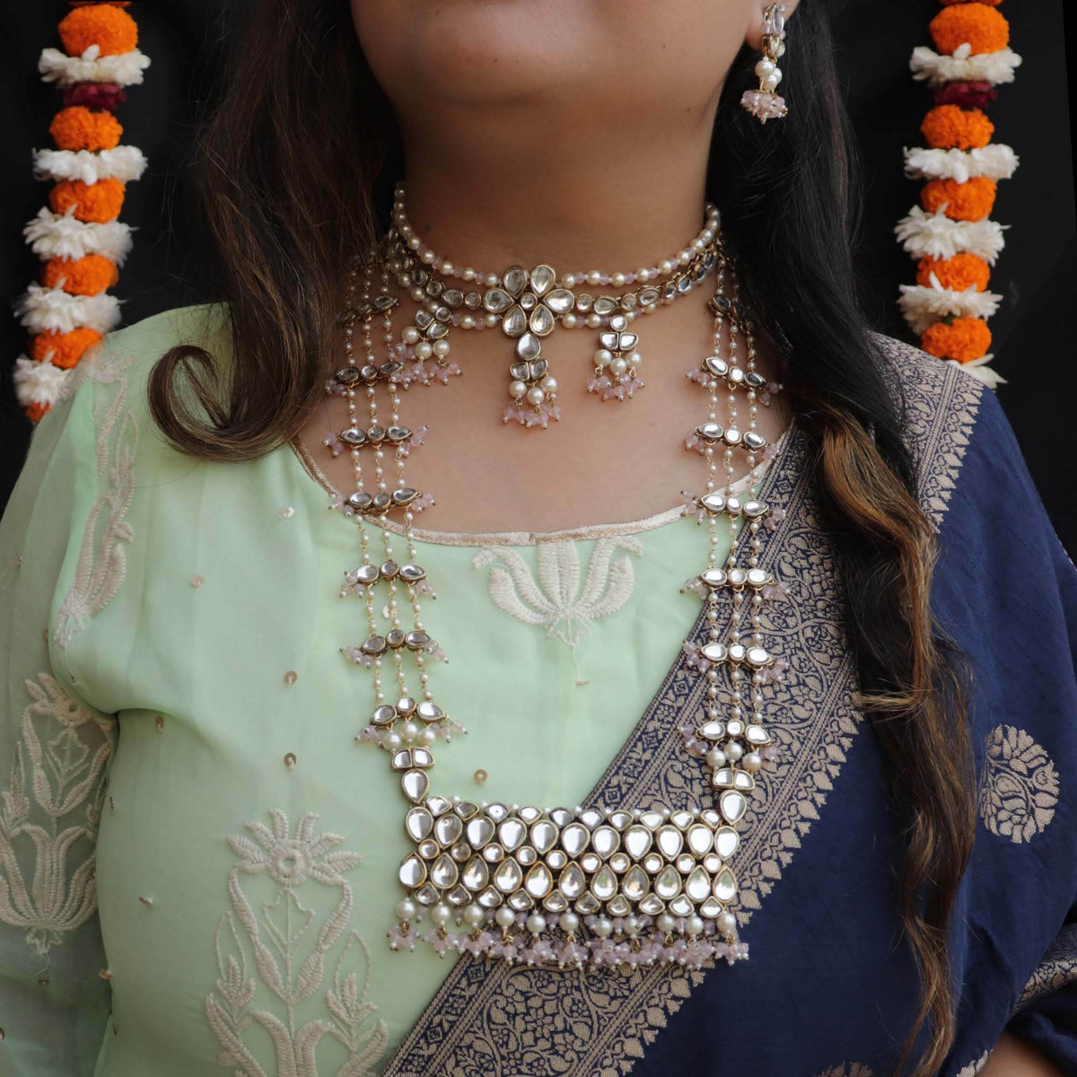 Kundan choker set in gold-tone with matching earrings and long bridal necklace, perfect for wedding functions , festive and bridal wear