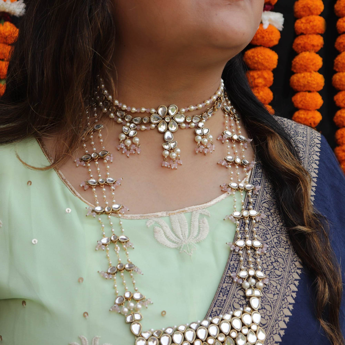 Kundan choker set in gold-tone with matching earrings and long bridal necklace, perfect for wedding functions , festive and bridal wear