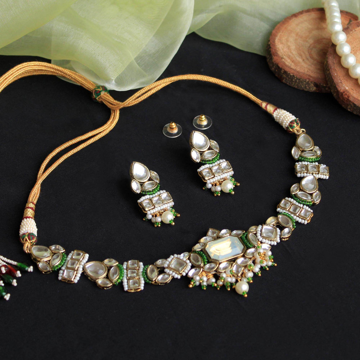 Kundan choker set in gold-tone with matching earrings and long bridal necklace, perfect for wedding functions , festive and bridal wear
