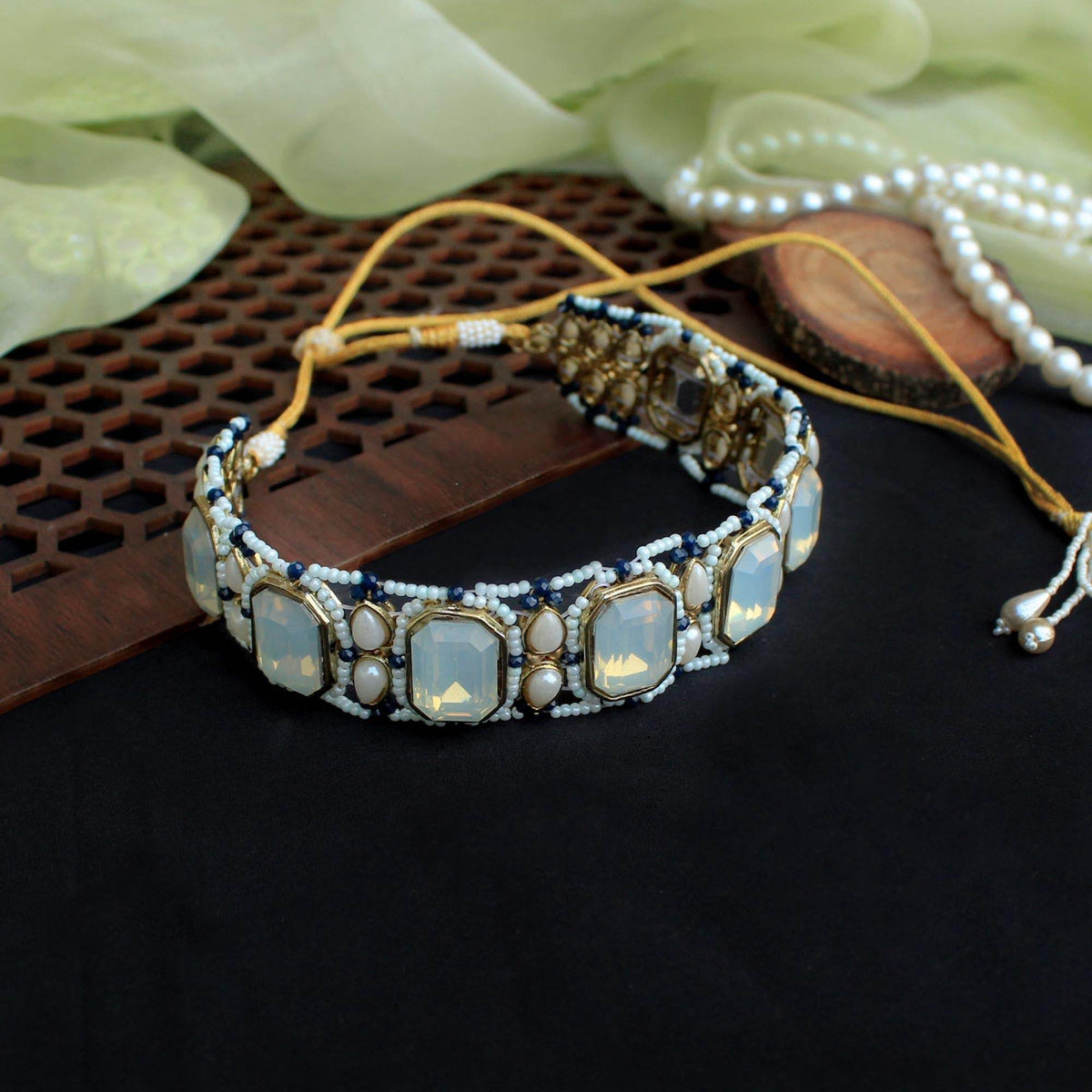 Kundan choker set in gold-tone with matching earrings and long bridal necklace, perfect for wedding functions , festive and bridal wear