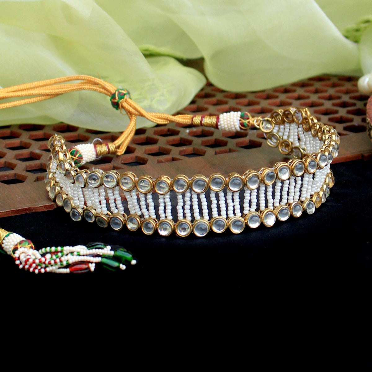 Kundan choker set in gold-tone with matching earrings and long bridal necklace, perfect for wedding functions , festive and bridal wear