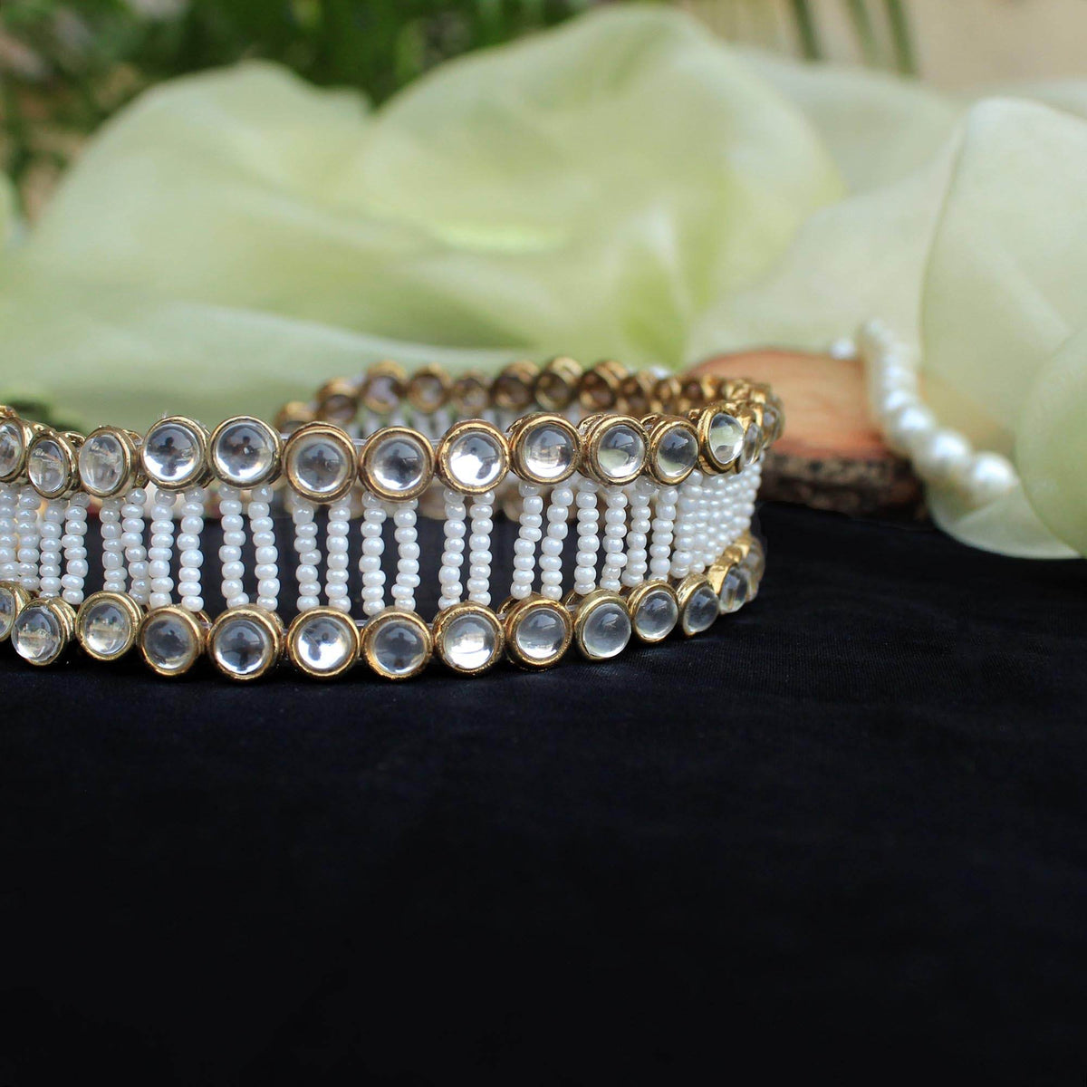 Kundan choker set in gold-tone with matching earrings and long bridal necklace, perfect for wedding functions , festive and bridal wear