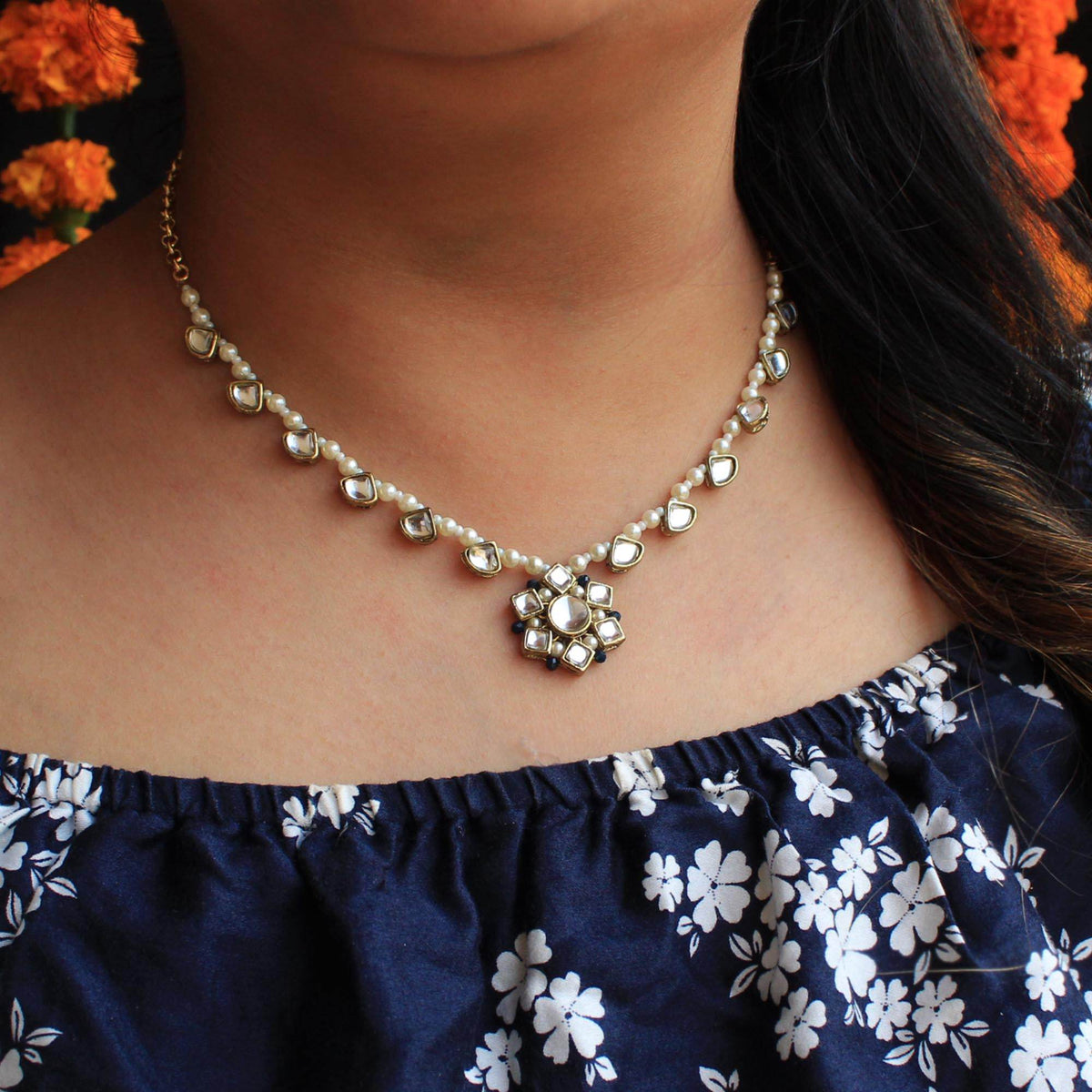 Kundan choker set in gold-tone with matching earrings and long bridal necklace, perfect for wedding functions , festive and bridal wear