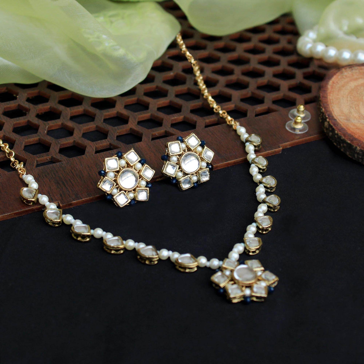 Kundan choker set in gold-tone with matching earrings and long bridal necklace, perfect for wedding functions , festive and bridal wear
