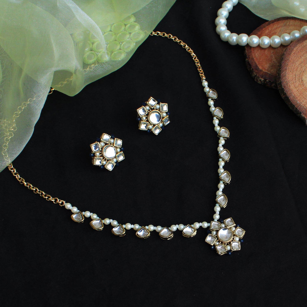 Kundan choker set in gold-tone with matching earrings and long bridal necklace, perfect for wedding functions , festive and bridal wear