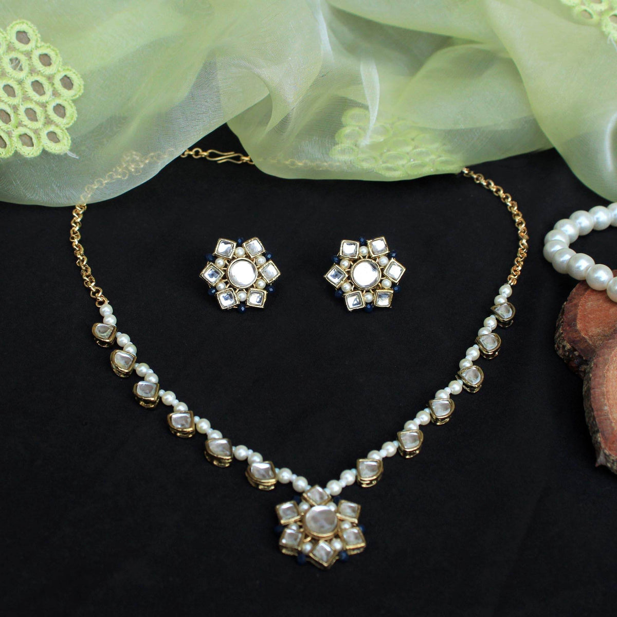 Kundan choker set in gold-tone with matching earrings and long bridal necklace, perfect for wedding functions , festive and bridal wear