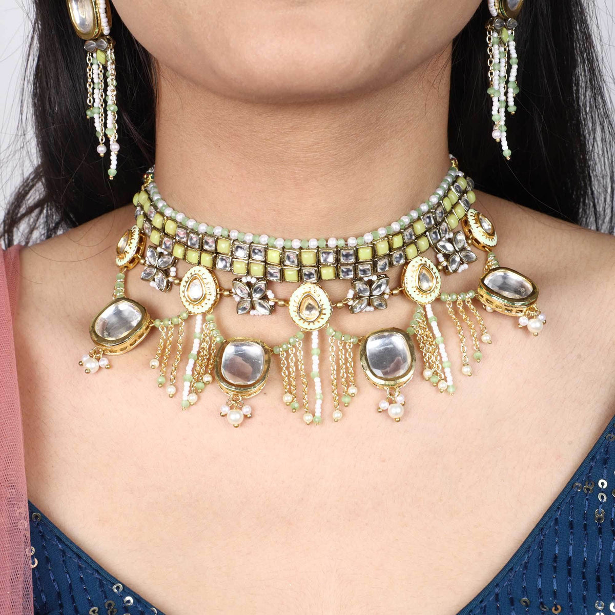 Kundan choker set in gold-tone with matching earrings and long bridal necklace, perfect for wedding functions , festive and bridal wear