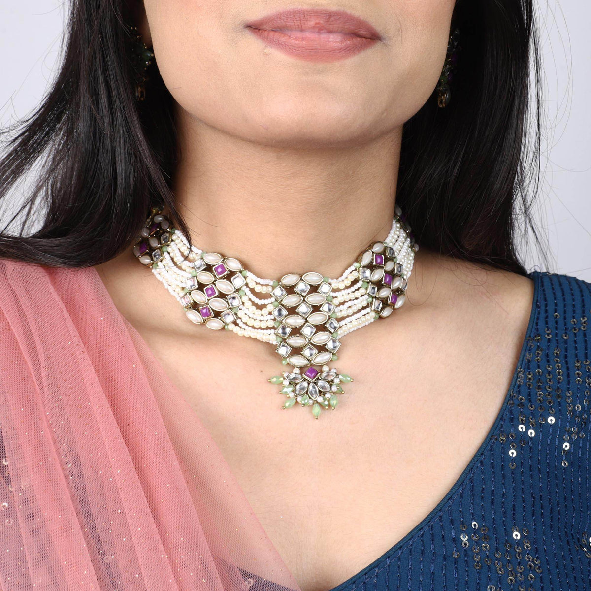 Kundan choker set in gold-tone with matching earrings and long bridal necklace, perfect for wedding functions , festive and bridal wear