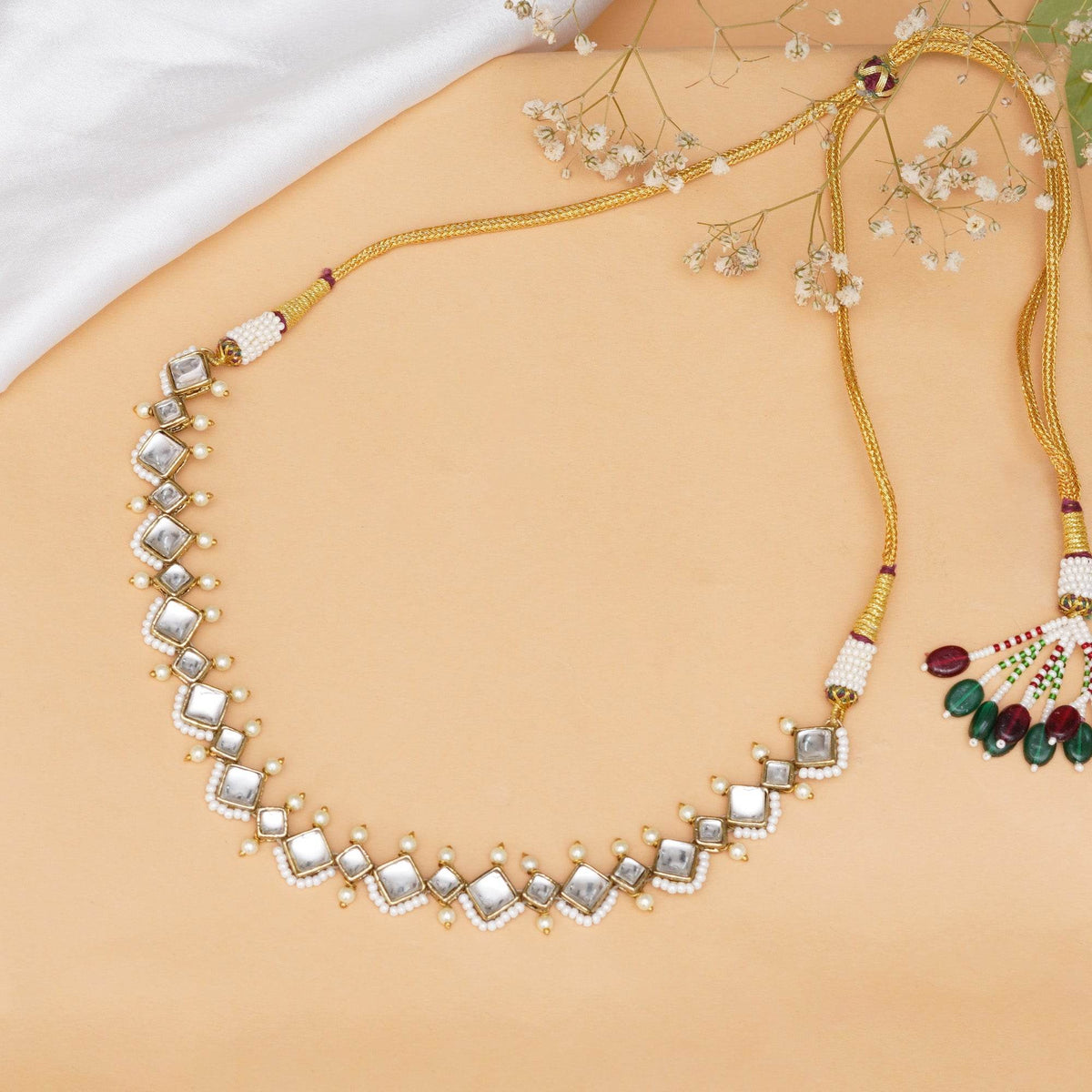 Kundan choker set in gold-tone with matching earrings and long bridal necklace, perfect for wedding functions , festive and bridal wear