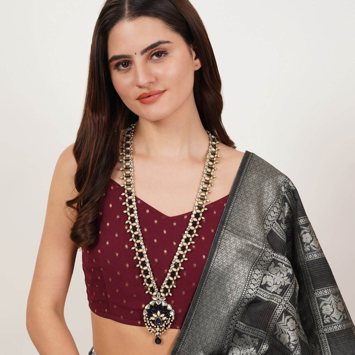 Kundan choker set in gold-tone with matching earrings and long bridal necklace, perfect for wedding functions , festive and bridal wear