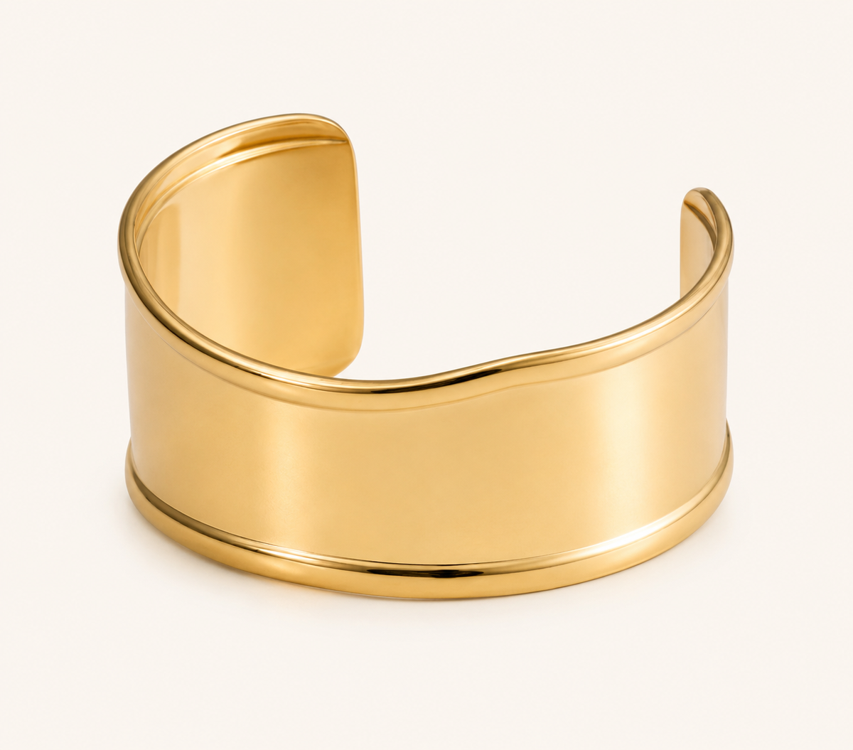 Classic wide mirror-polished open cuff bangle in silver and gold tones with sculpted silhouette
