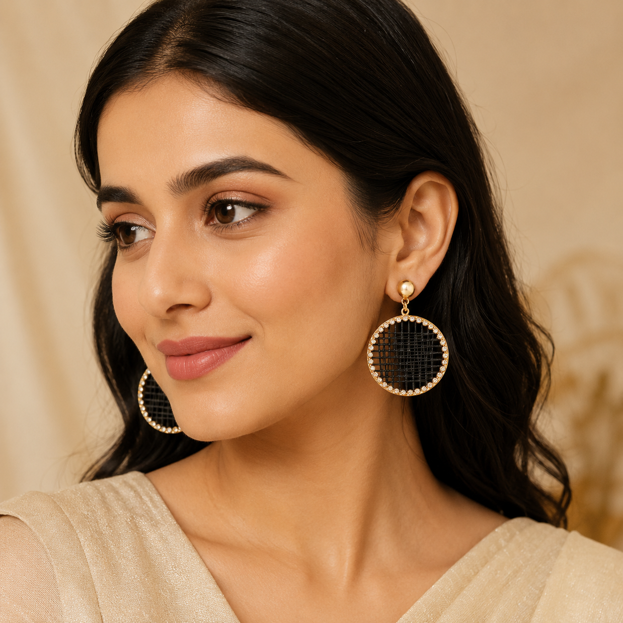 Close-up view of black woven earrings with crystal border