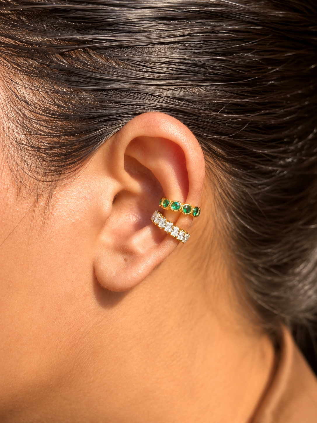 Close-up of Nyra gold-plated statement ear cuff �? sleek 18k gold-plated no-piercing single-piece cuff for festive ear stacks.