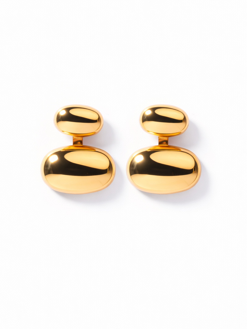 Pair of gold-plated pebble stud earrings styled the first way �? multipurpose studs for office and evening looks.