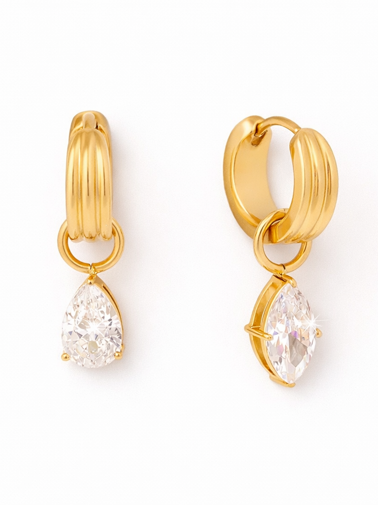 18k gold-plated Noor teardrop crystal huggie earrings �? sparkle minimal huggies, anti-tarnish and waterproof for everyday and evening wear.