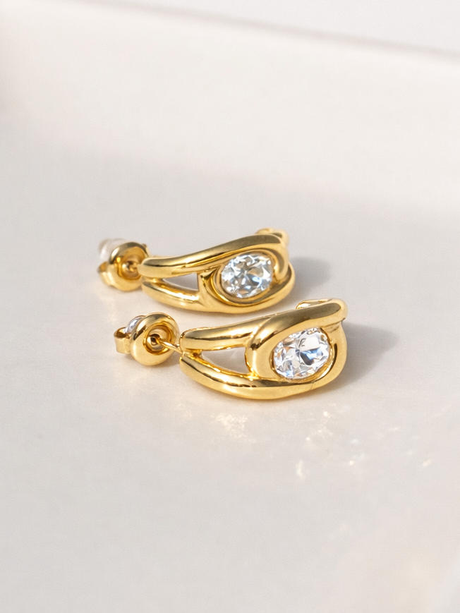 Pair of Halo crystal studs �? 18k gold-plated bold sculpted halo earrings for evening and gifting.