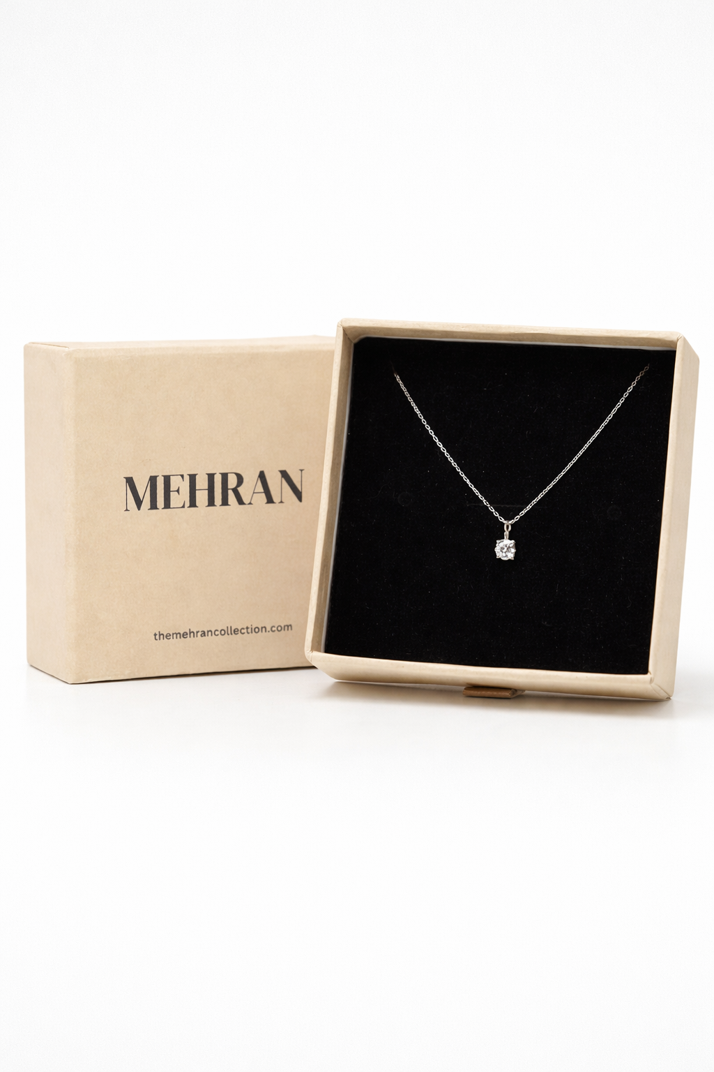 Close-up of solitaire moissanite necklace �? 925 sterling silver round-cut pendant for everyday-luxury and gifting.