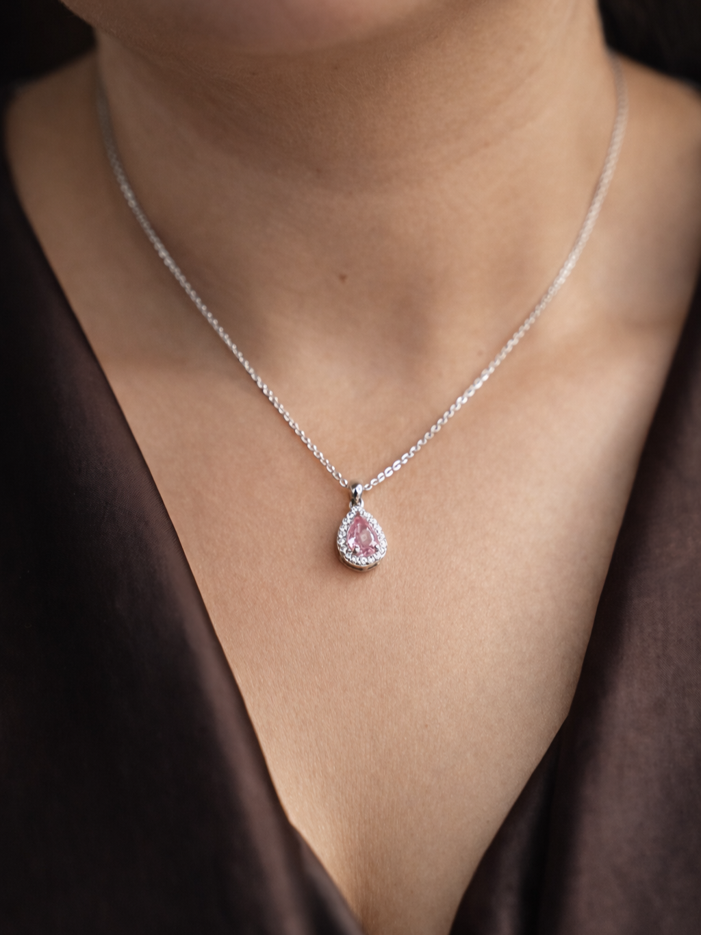 Styled view of Ros?? drop moissanite necklace �? sterling silver pink pendant for everyday-luxury and gifting.