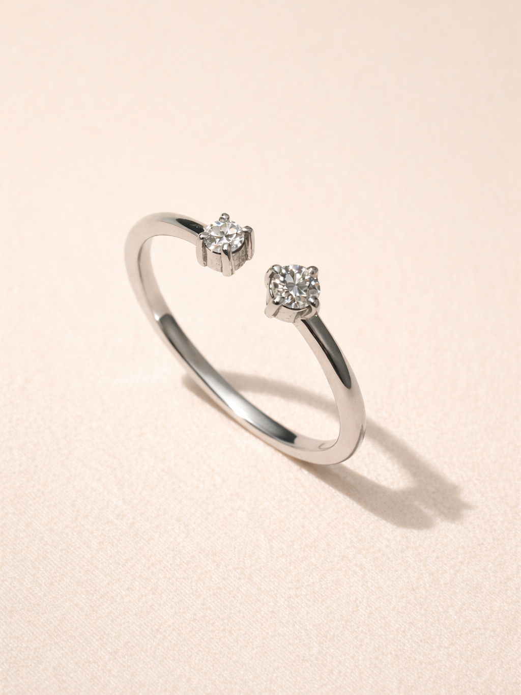 Close-up of Open Moissanite ring �? diamond-alternative twin-stone ring on sterling silver for bridal styling.