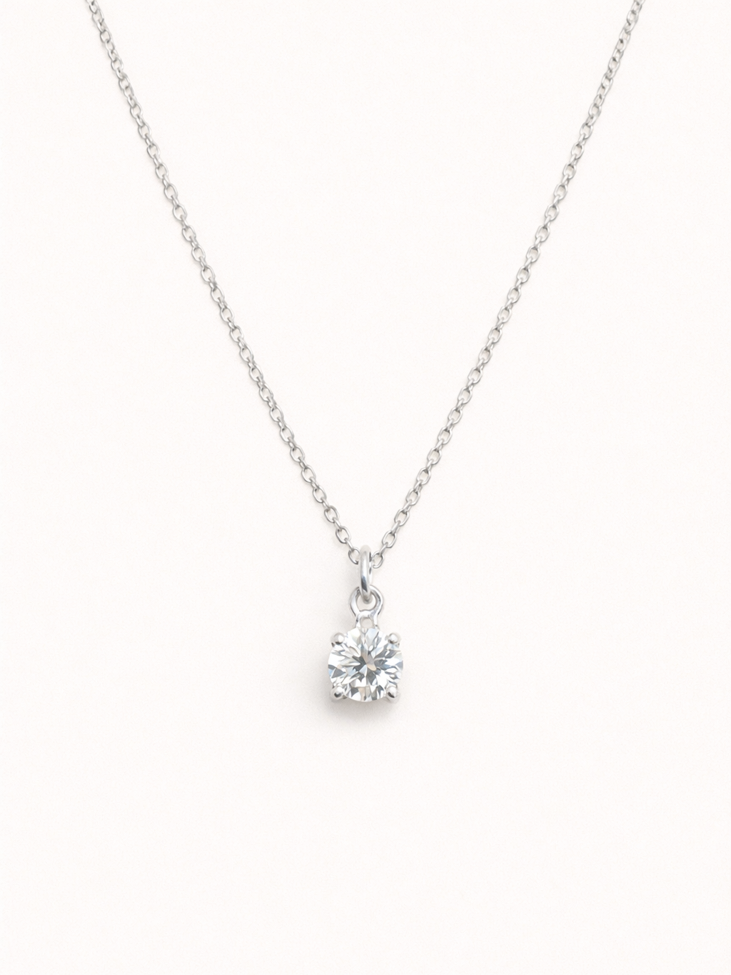 Pair view of solitaire moissanite necklace �? sterling silver diamond-alternative pendant for bridal styling.