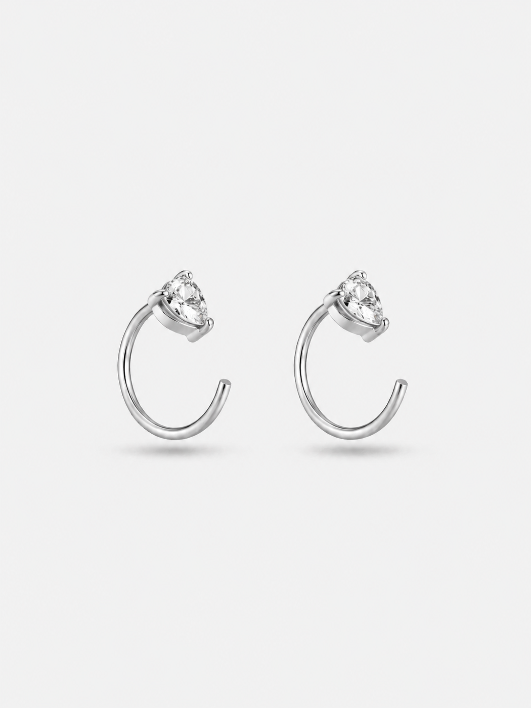 Pair of sterling silver pear hoop earrings in silver finish �? versatile poke-free hoops, sleep-safe for kids and sensitive ears.