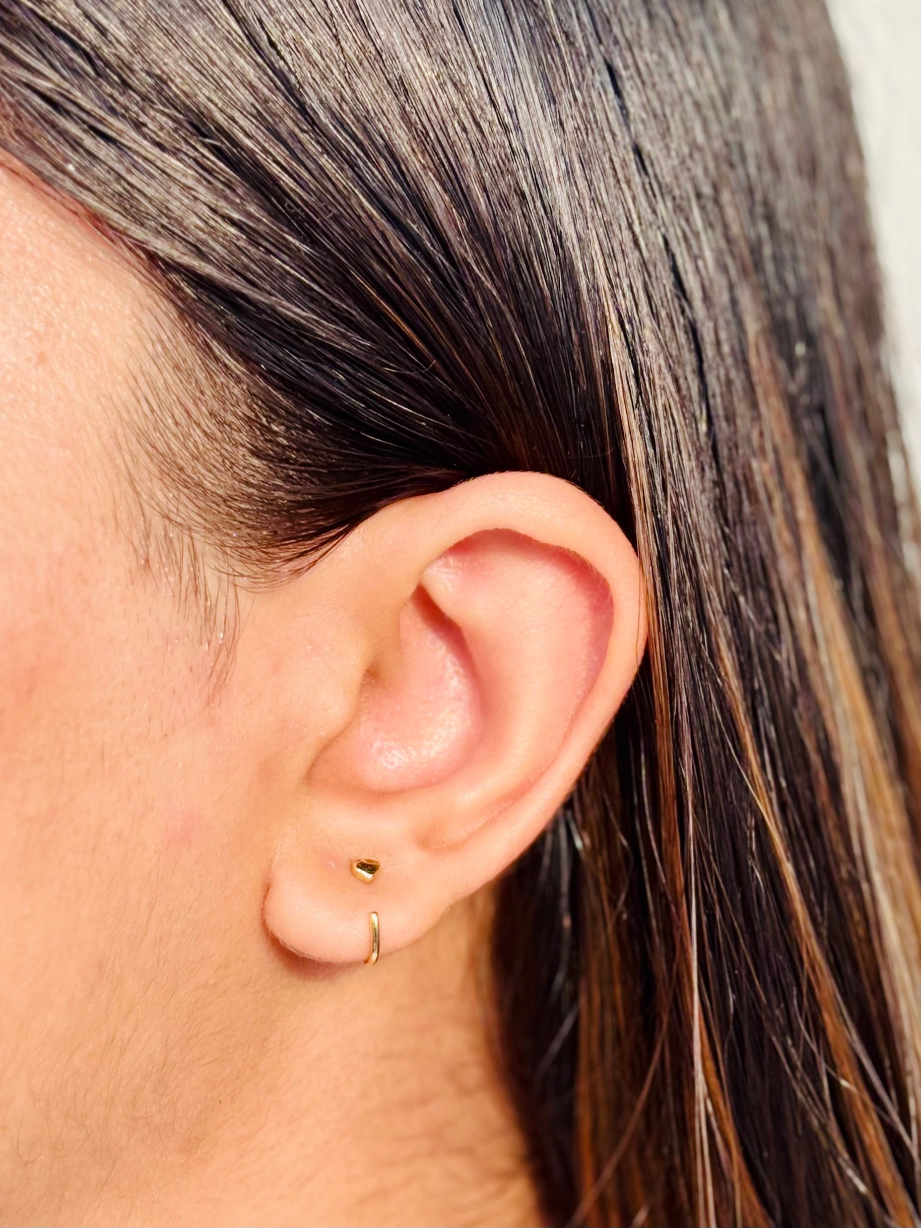 Pair of 925 sterling silver heart hoop earrings �? poke-free hypoallergenic hoops, safe for kids and sensitive skin.