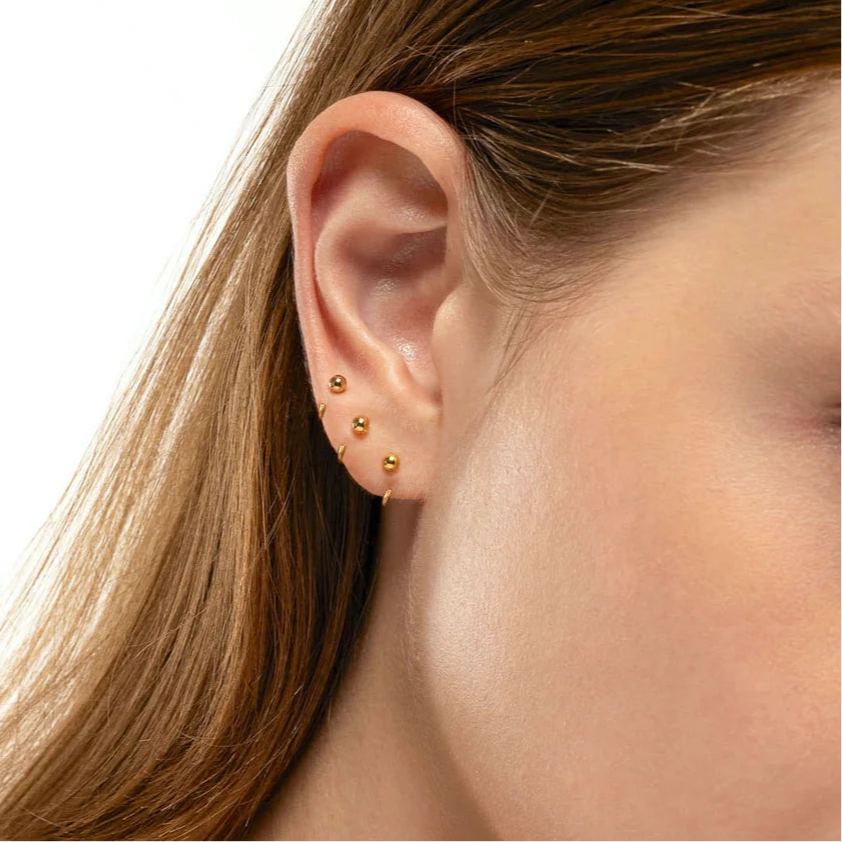 Side view of sterling silver ball hoop earrings �? poke-free lightweight design, sleep-safe for kids and gentle for sensitive ears.