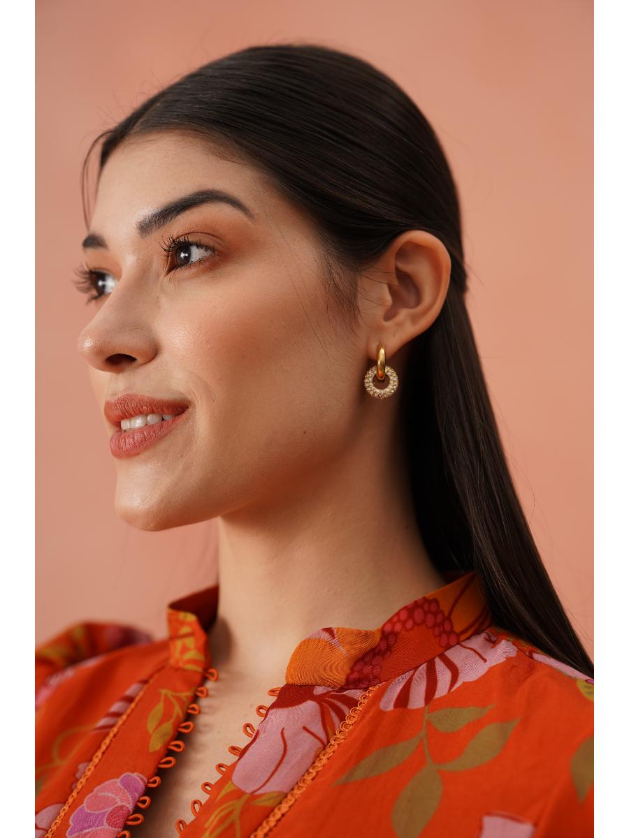 Pair of gold-plated sparkle huggie earrings �? versatile day-to-night hoops for everyday and evening wear.