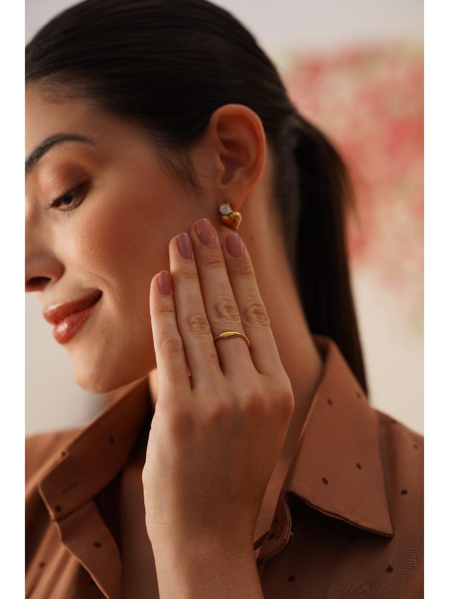 Detail shot of 18k gold-plated heart stone earrings �? anti-tarnish, lightweight stainless steel design.
