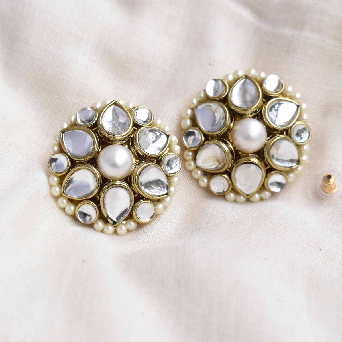 Traditional Kundan earrings in gold-tone, perfect for weddings and festive wear