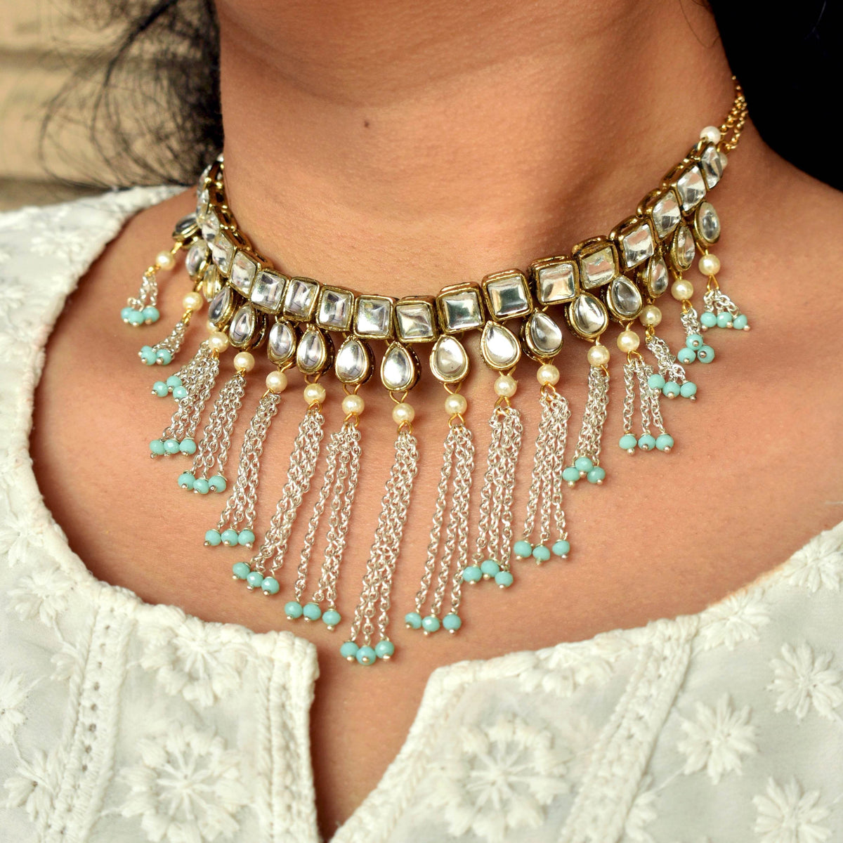 Kundan choker set in gold-tone with matching earrings and long bridal necklace, perfect for wedding functions , festive and bridal wear