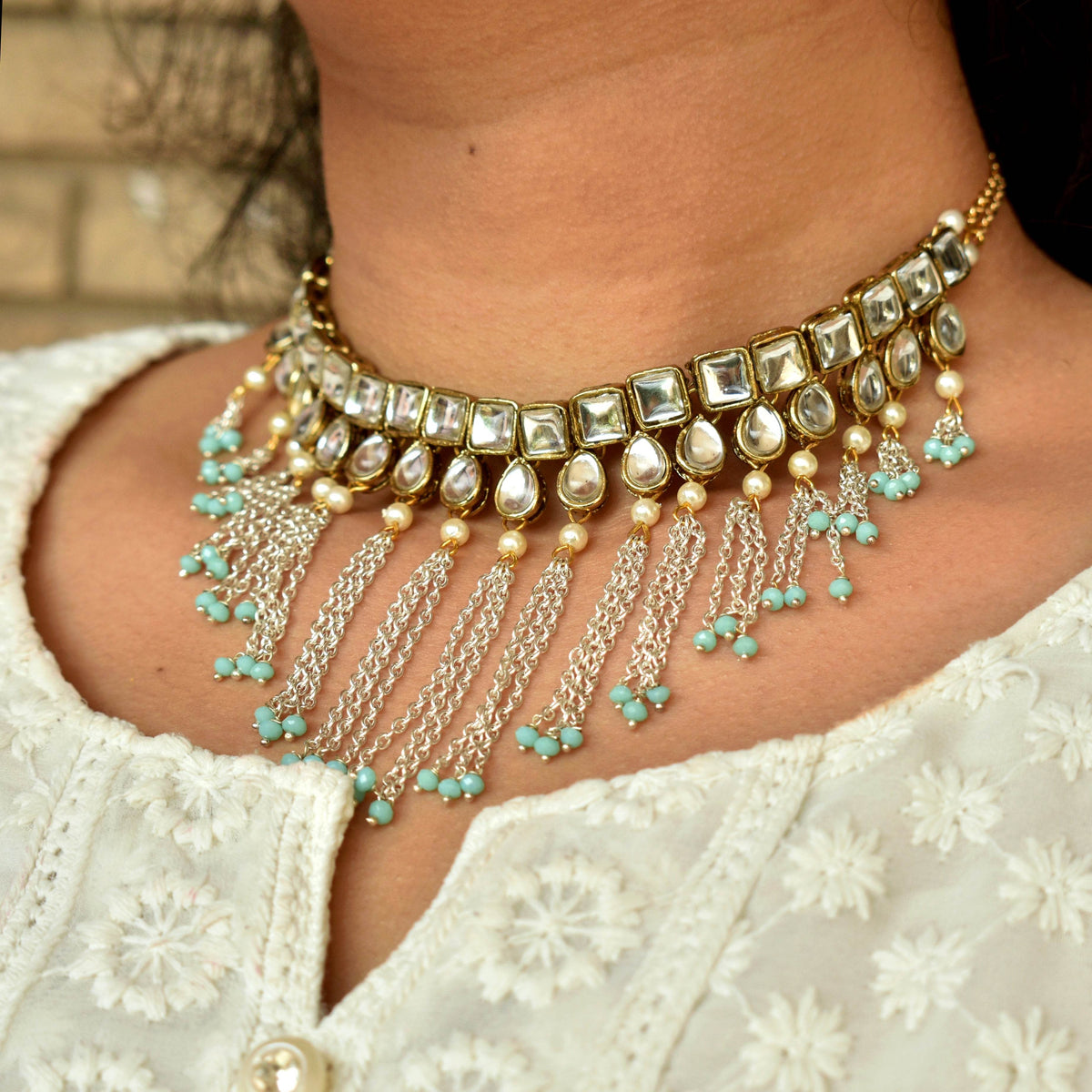 Kundan choker set in gold-tone with matching earrings and long bridal necklace, perfect for wedding functions , festive and bridal wear