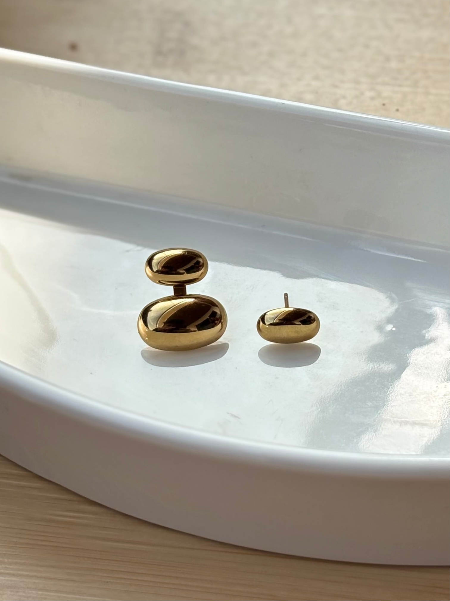 Pebble studs displayed together �? 18k gold-plated 2-way studs perfect for office, evening, and gifting.