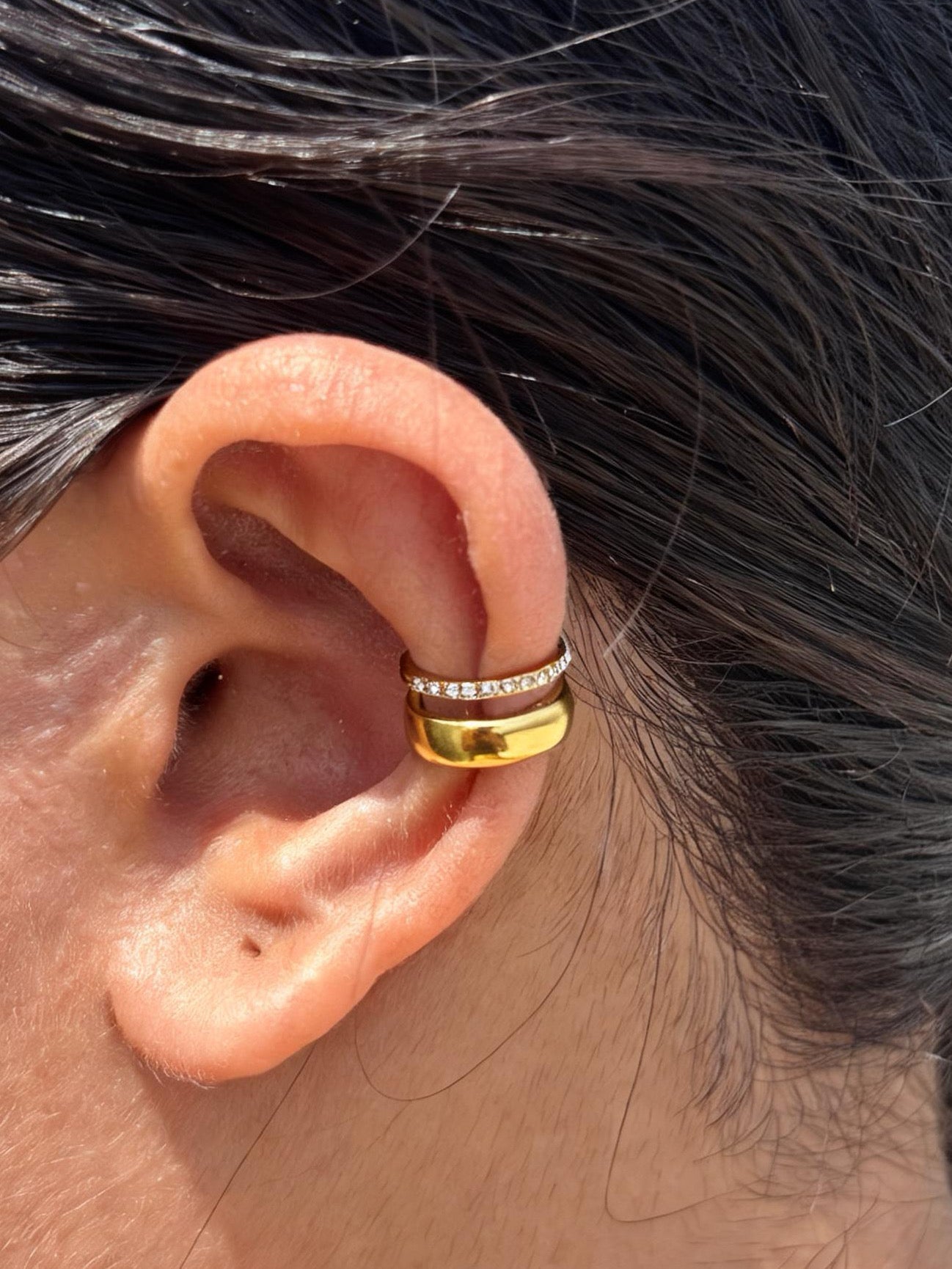 Close-up of gold-plated Kiara ear cuff �? sleek lightweight no-piercing cuff for everyday and casual styling.