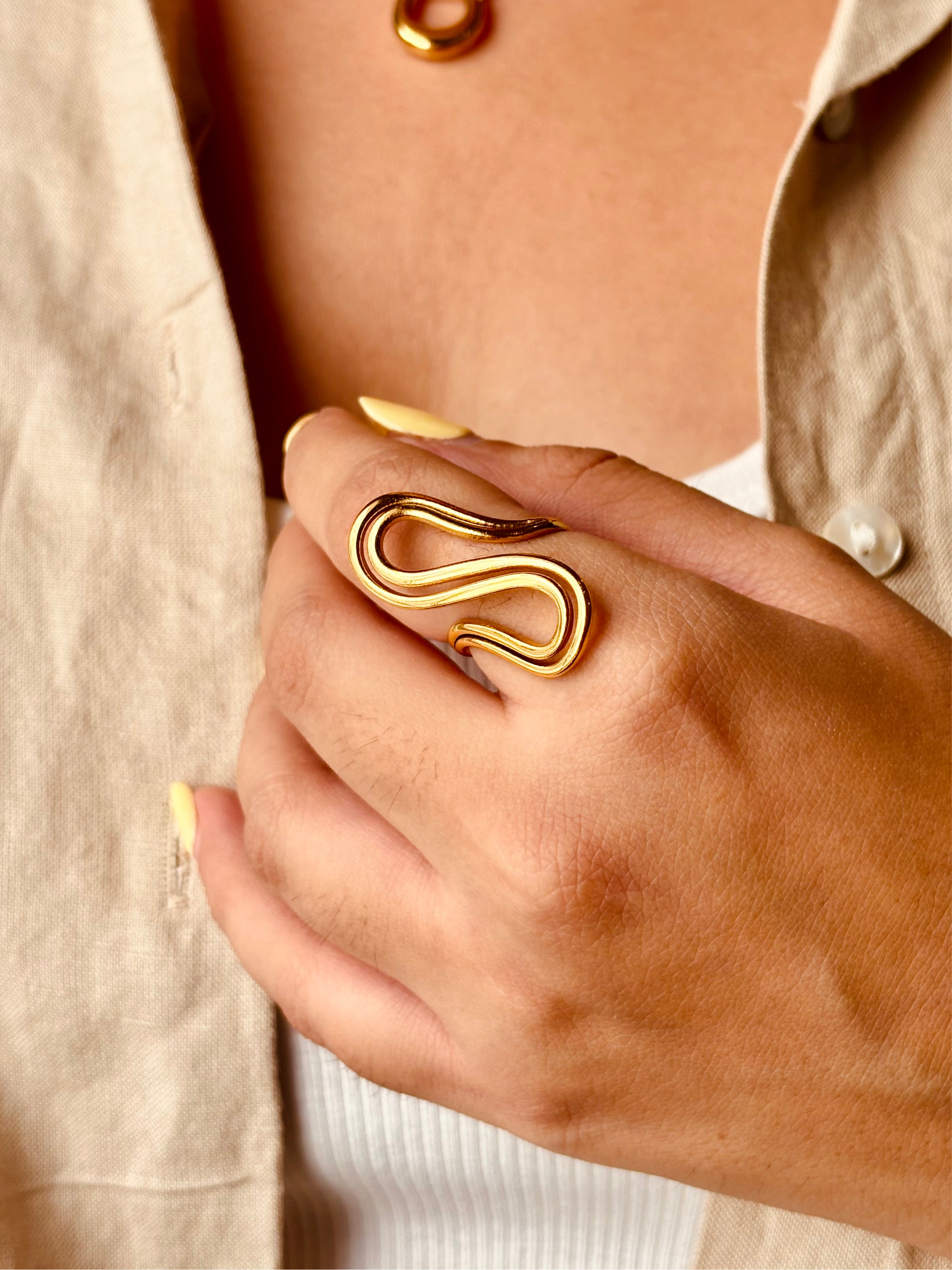 Styled view of Twirl ring �? 18k gold-plated minimal twirl ring for everyday and gifting.