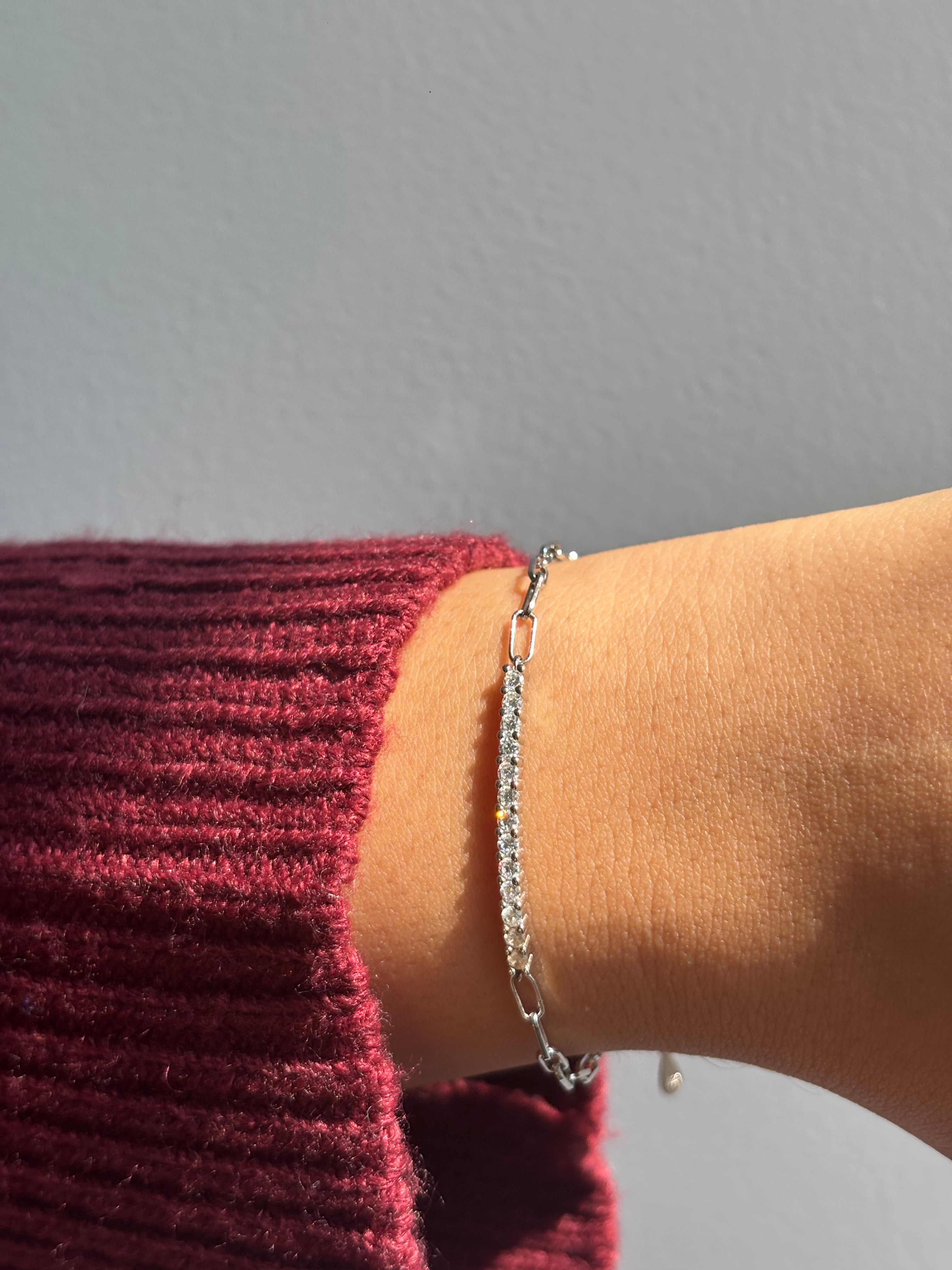 Styled view of moissanite tennis chain bracelet �? sterling silver sleek diamond-alternative bracelet for gifting and evening looks.