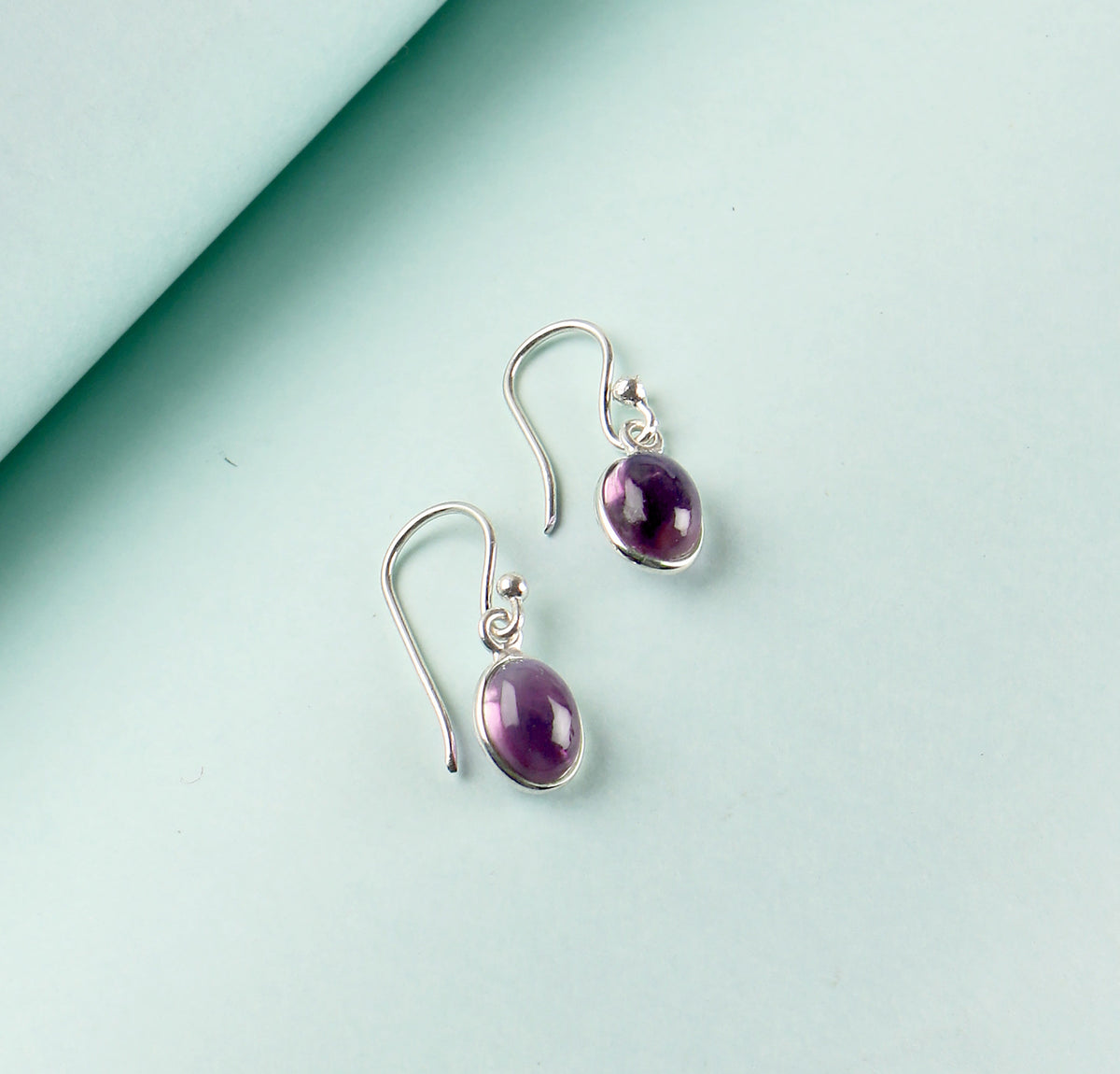 925 Silver oval cabuchon Amethyst Earring in oxidised finish in bezel setting with ball earwire.