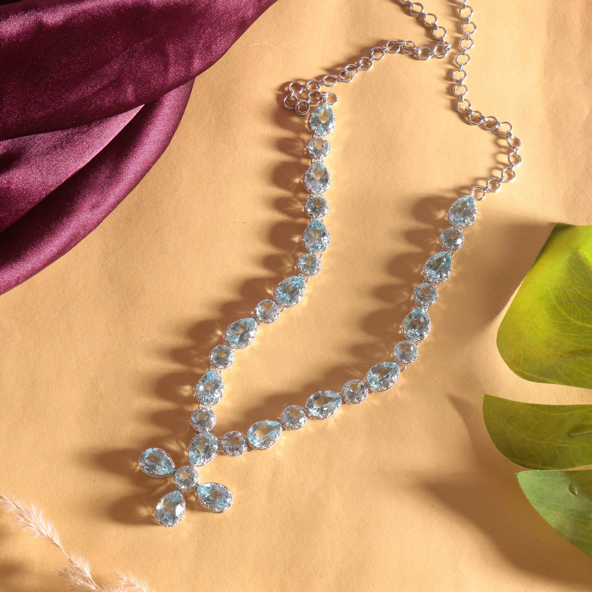 925 Sterling Silver Dazzling Blue Topaz Cross Drop Necklace in Sterling Silver
