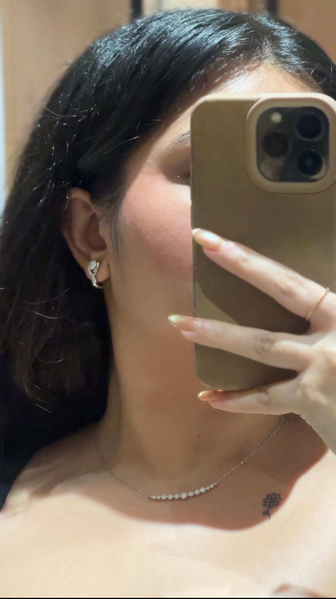 Pair of sterling silver moissanite twist huggies �? 925 silver diamond-alternative huggies for everyday-luxury styling.