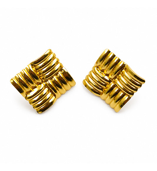 Gold ribbed knot stud earrings pair on white background