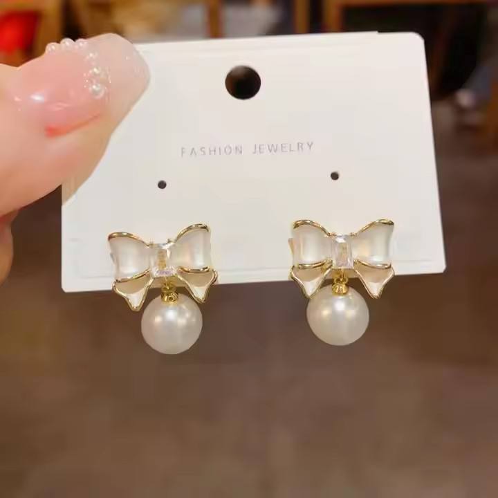 astria-jewellery-bow-pearl-drop-earrings-for-women-gold-plated-cute-bow-stud-with-pearl-minimal-elegant-earrings-for-girls-daily-wear