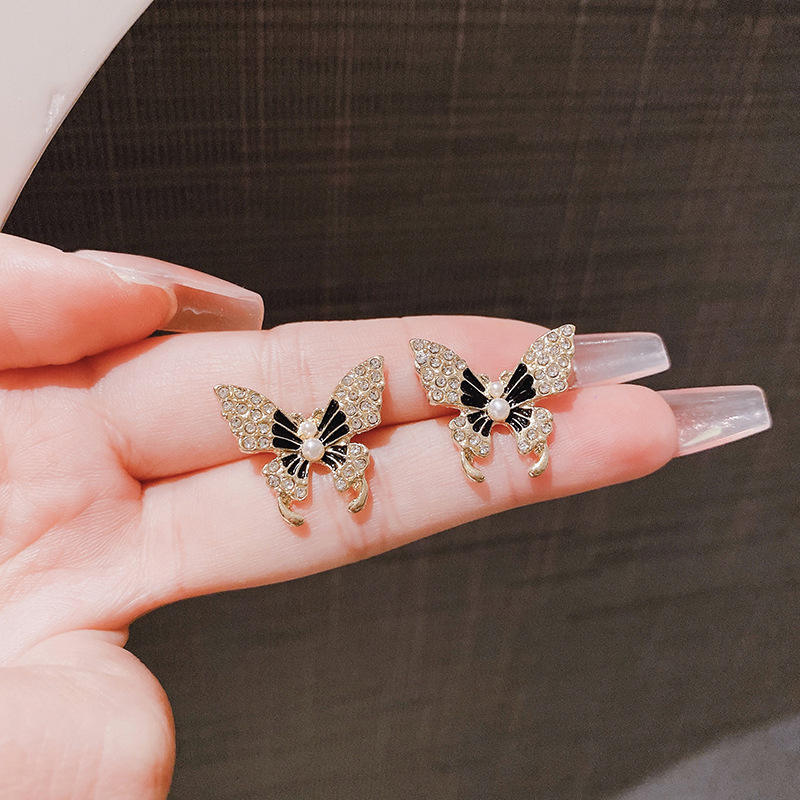 astria-jewellery-gold-plated-butterfly-stud-earrings-for-women-glitter-finish-with-pearl-center-cute-trendy-party-daily-wear-jewellery