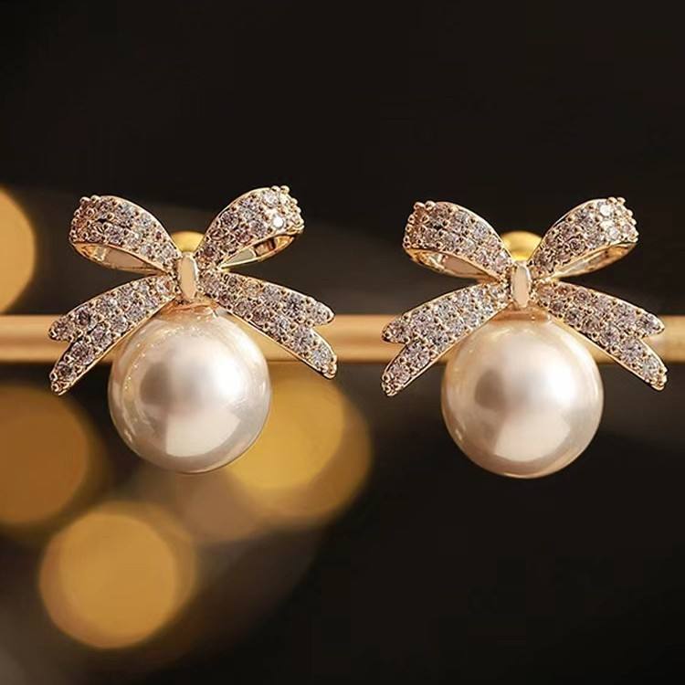 astria-jewellery-luxury-crystal-bow-pearl-drop-earrings-for-women-gold-plated-designer-statement-earrings-elegant-party-wedding-wear-jewellery